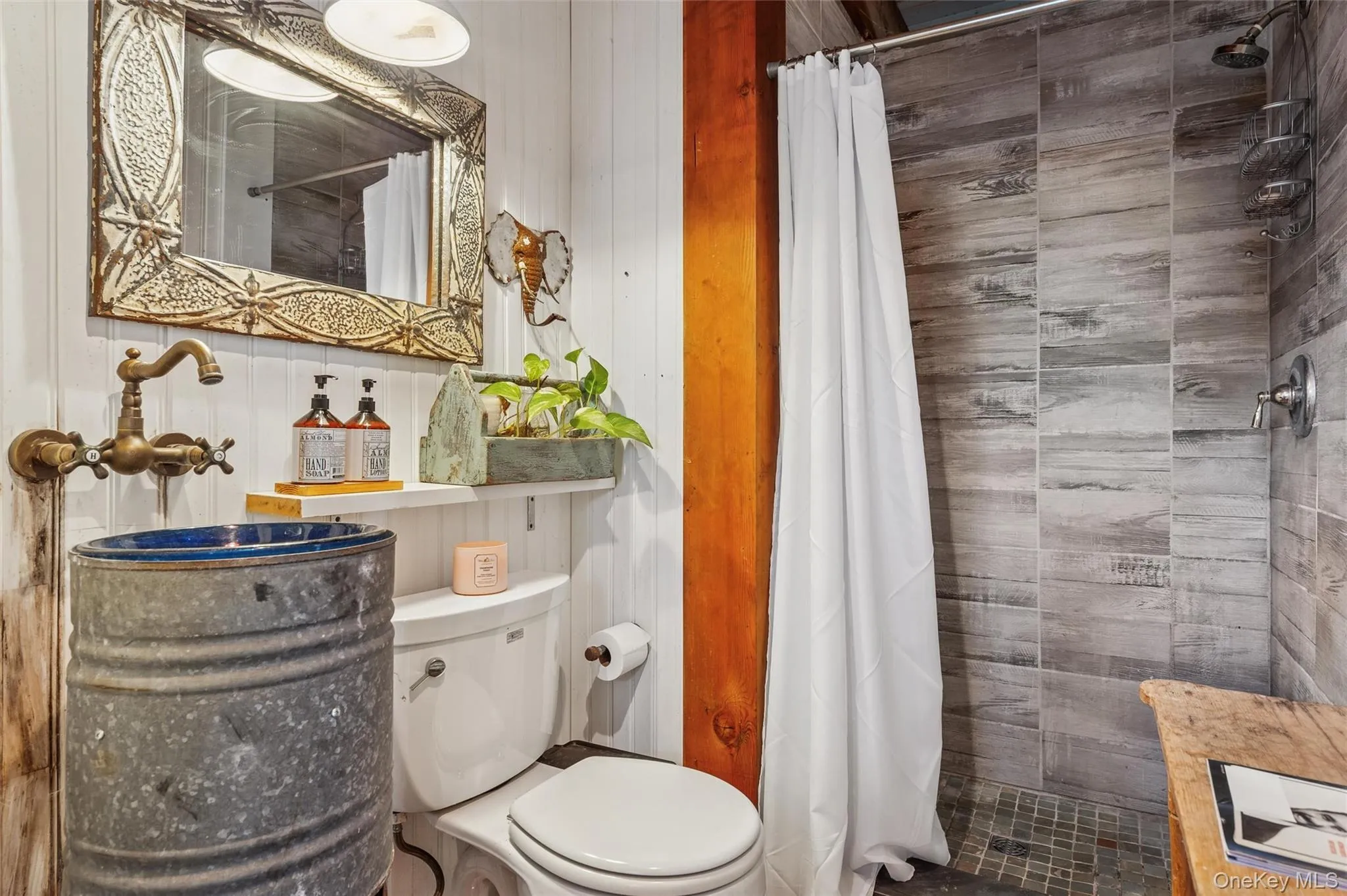 Full bathroom with a tile shower Full bathroom with a tile shower