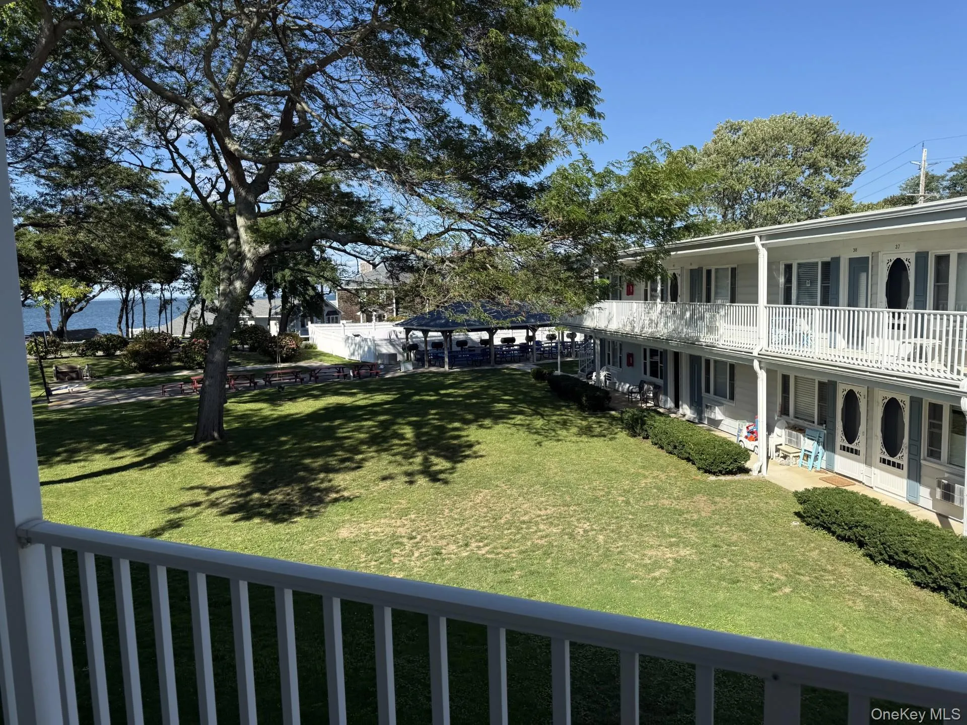 View of community with a balcony and covered porch View of community with a balcony and covered porch
