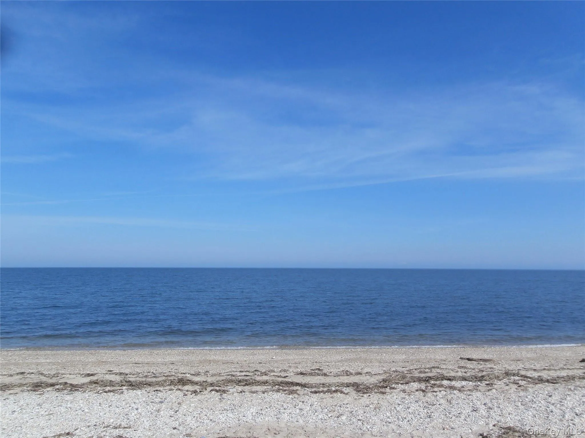 Water view featuring local beach Water view featuring local beach