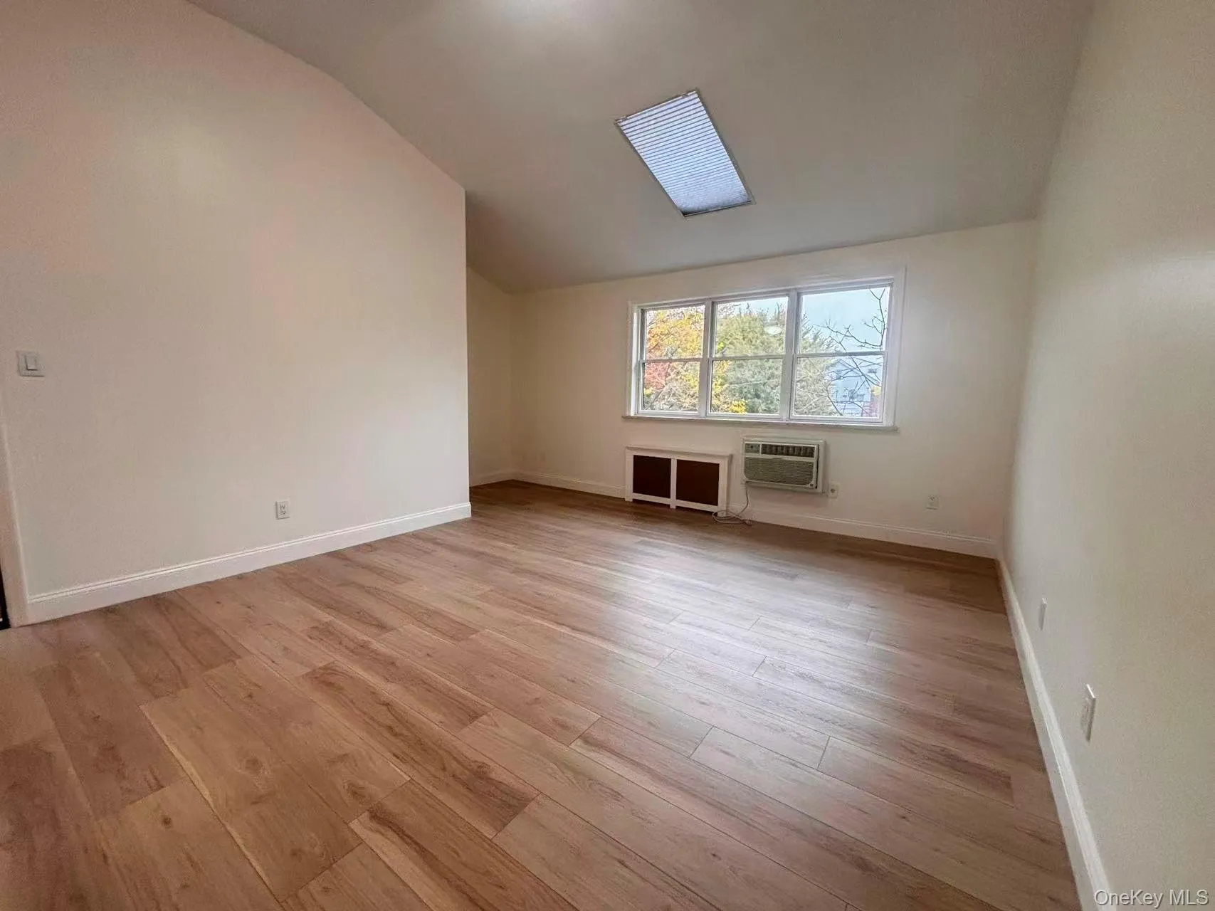 Additional living space with lofted ceiling and light wood finished floors Additional living space with lofted ceiling and light wood finished floors