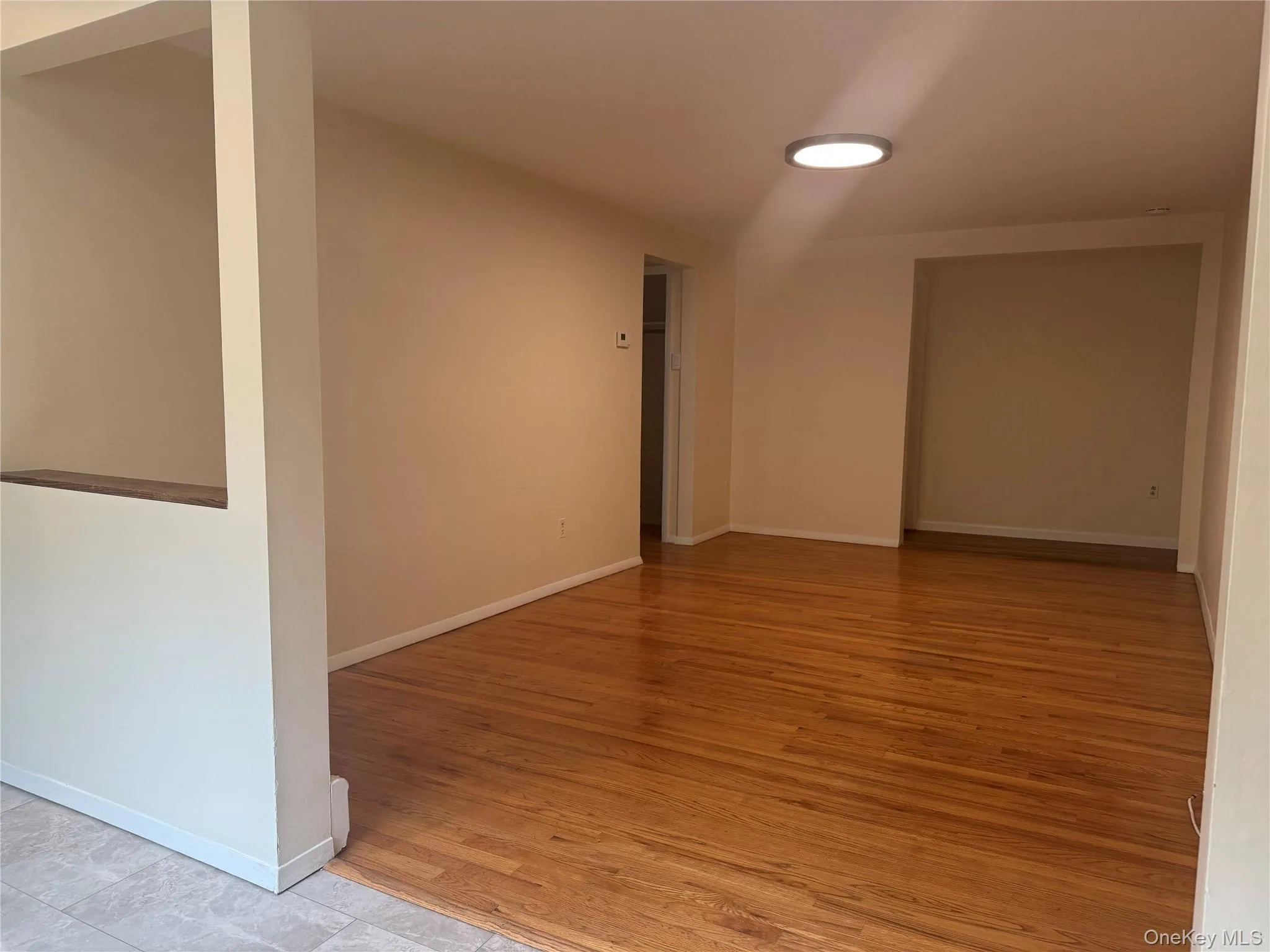 Large living room with wood floors and office nook - open to foyer/entry area Large living room with wood floors and office nook - open to foyer/entry area