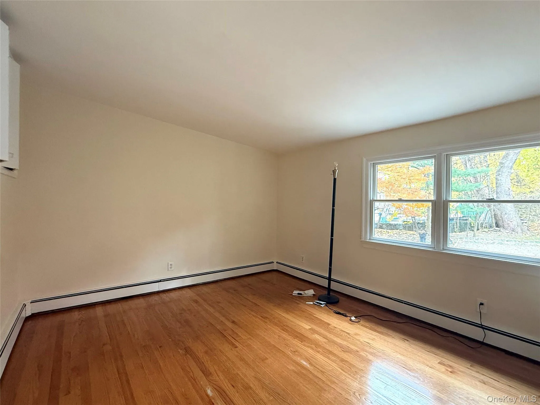 Upper level bedroom with wood floors and lots of storage/closets Upper level bedroom with wood floors and lots of storage/closets