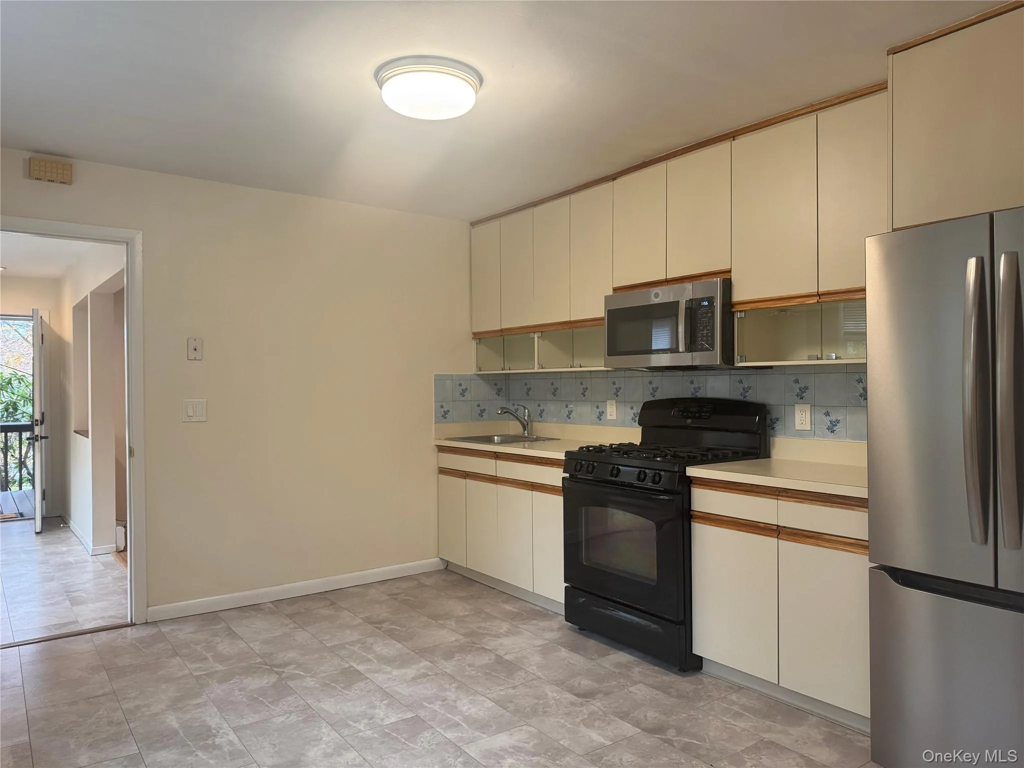 Large eat-in kitchen with new floors, refrigerator and microwave Large eat-in kitchen with new floors, refrigerator and microwave