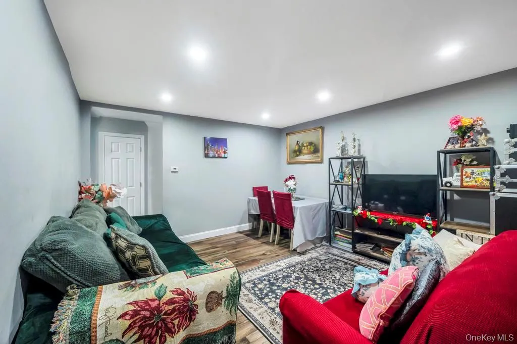 Living room with wood finished floors and baseboards Living room with wood finished floors and baseboards