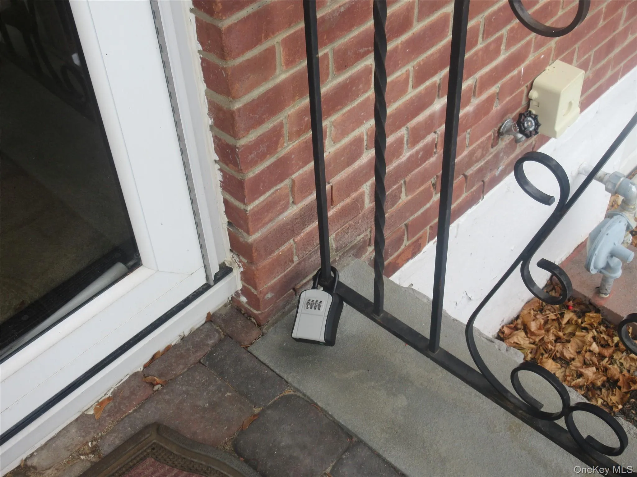 Exterior view of lawncare items and brick siding Exterior view of lawncare items and brick siding