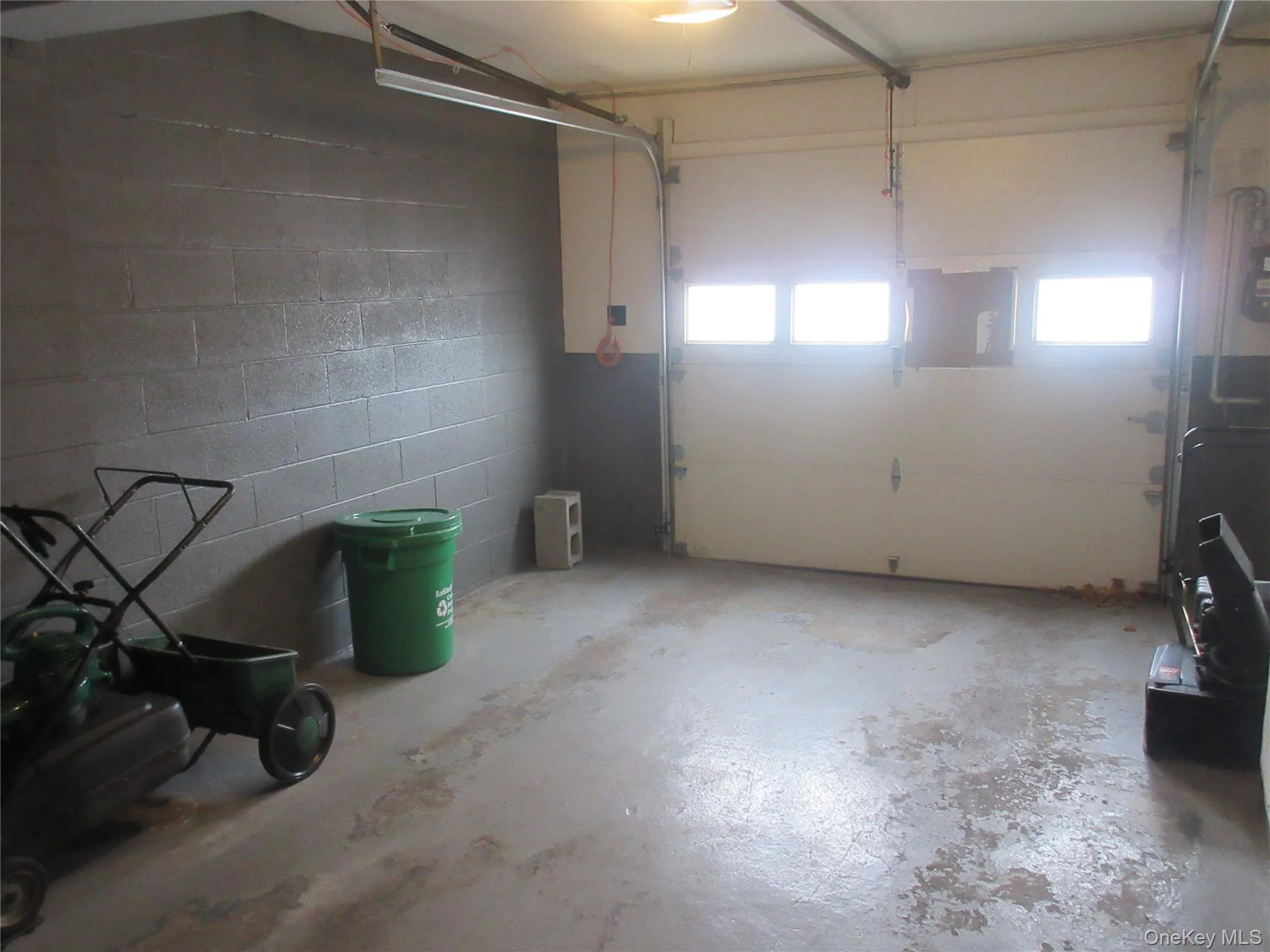 Garage featuring concrete block wall Garage featuring concrete block wall