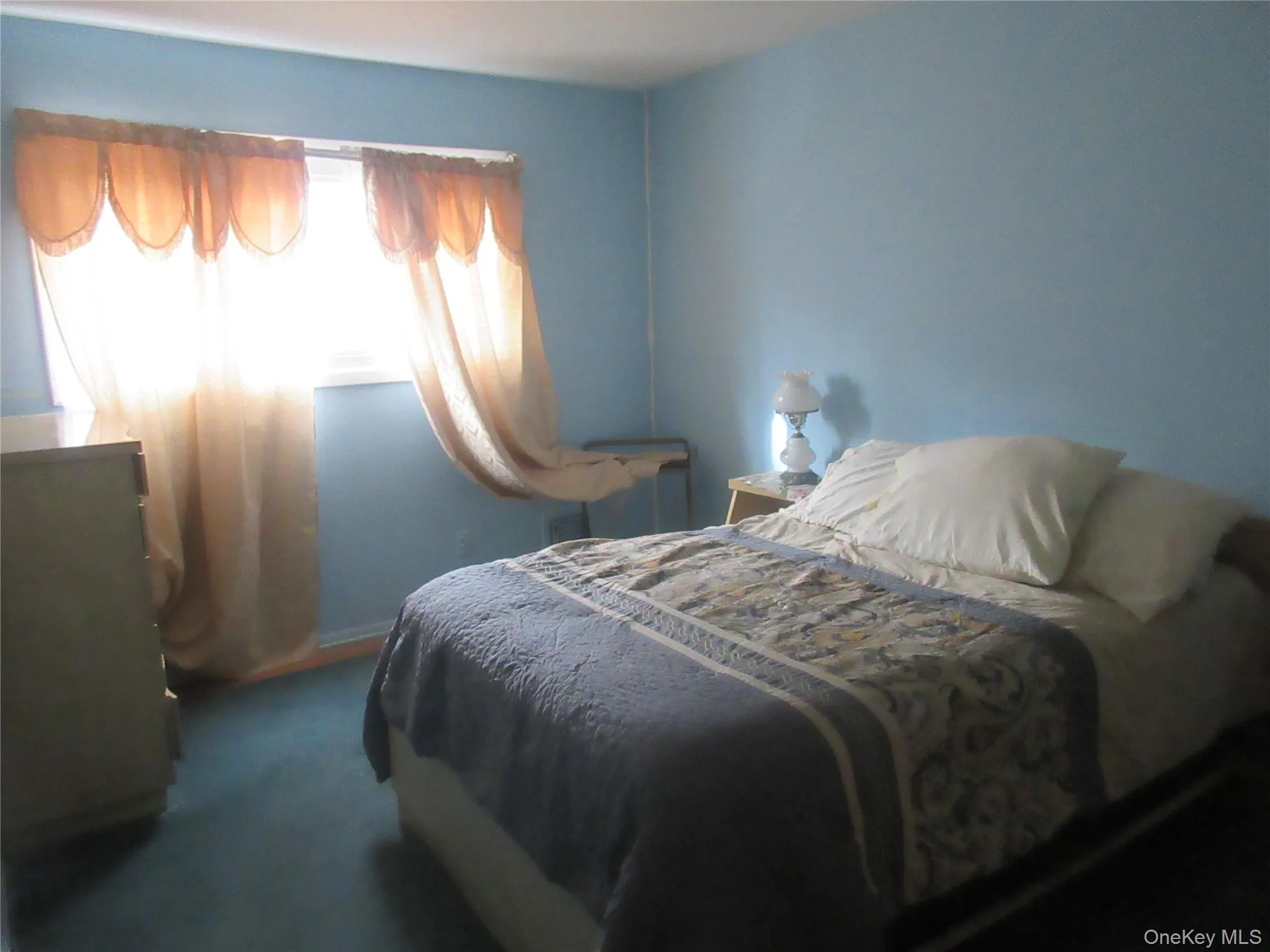 Bedroom featuring dark colored carpet Bedroom featuring dark colored carpet