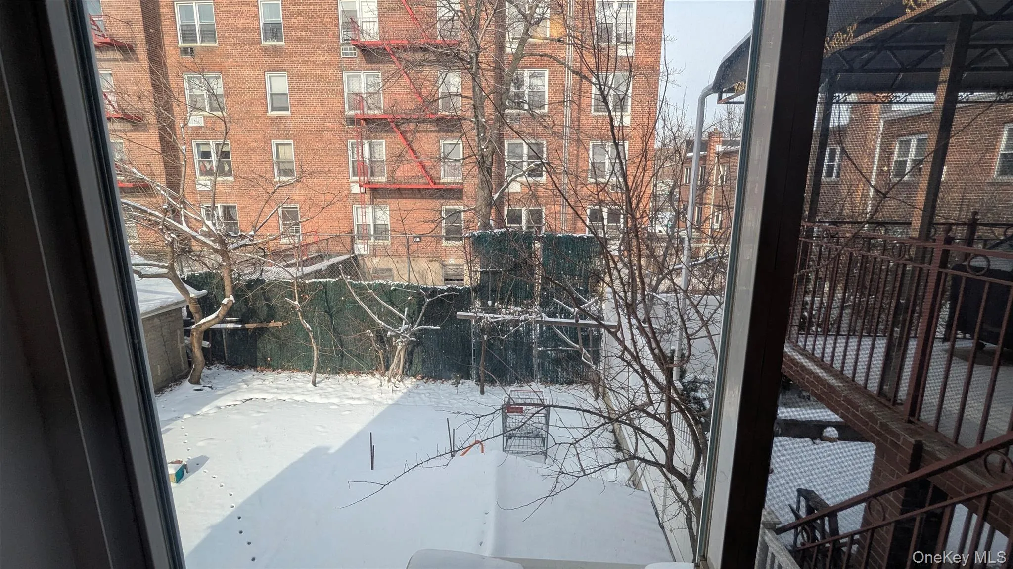 View of snow covered back of property View of snow covered back of property