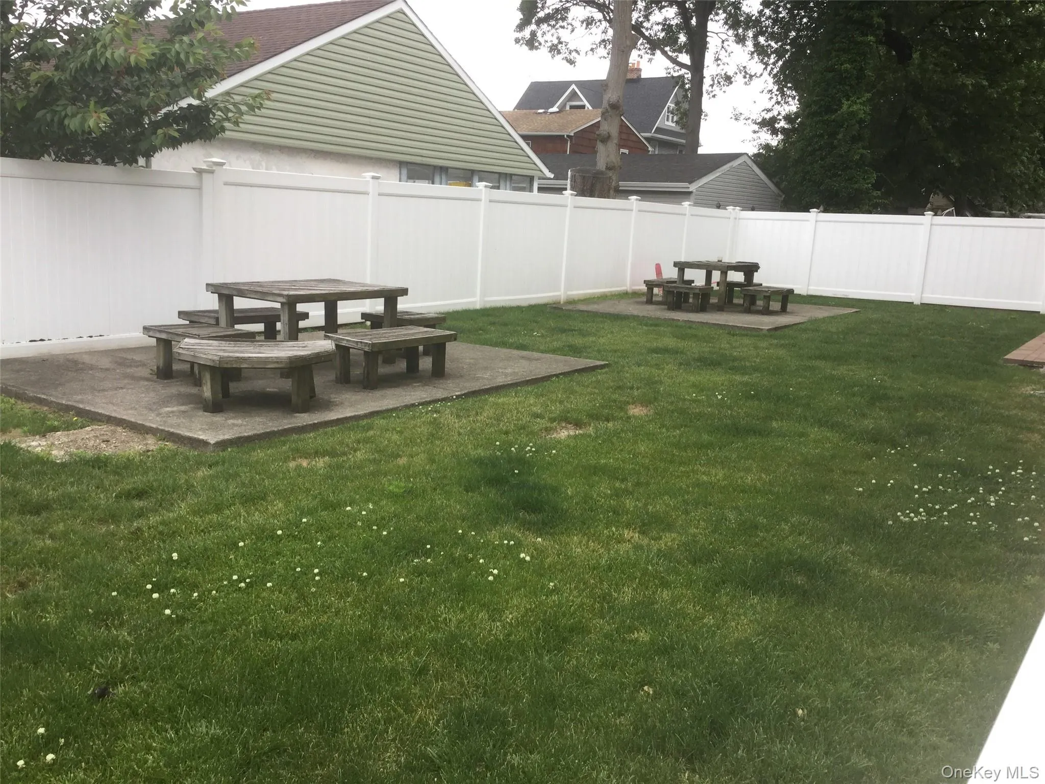 Fenced backyard with a patio Fenced backyard with a patio