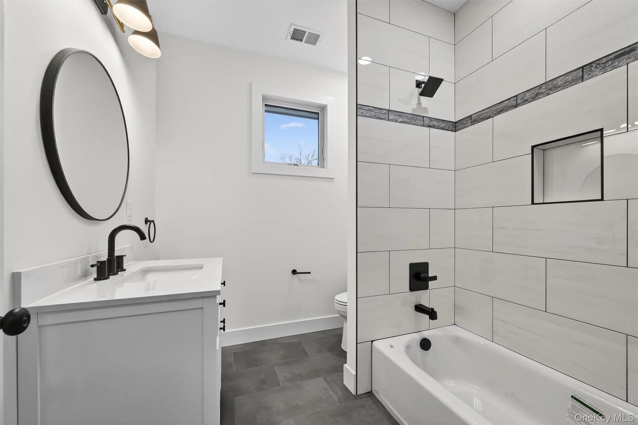 Bathroom featuring vanity and shower combination Bathroom featuring vanity and shower combination