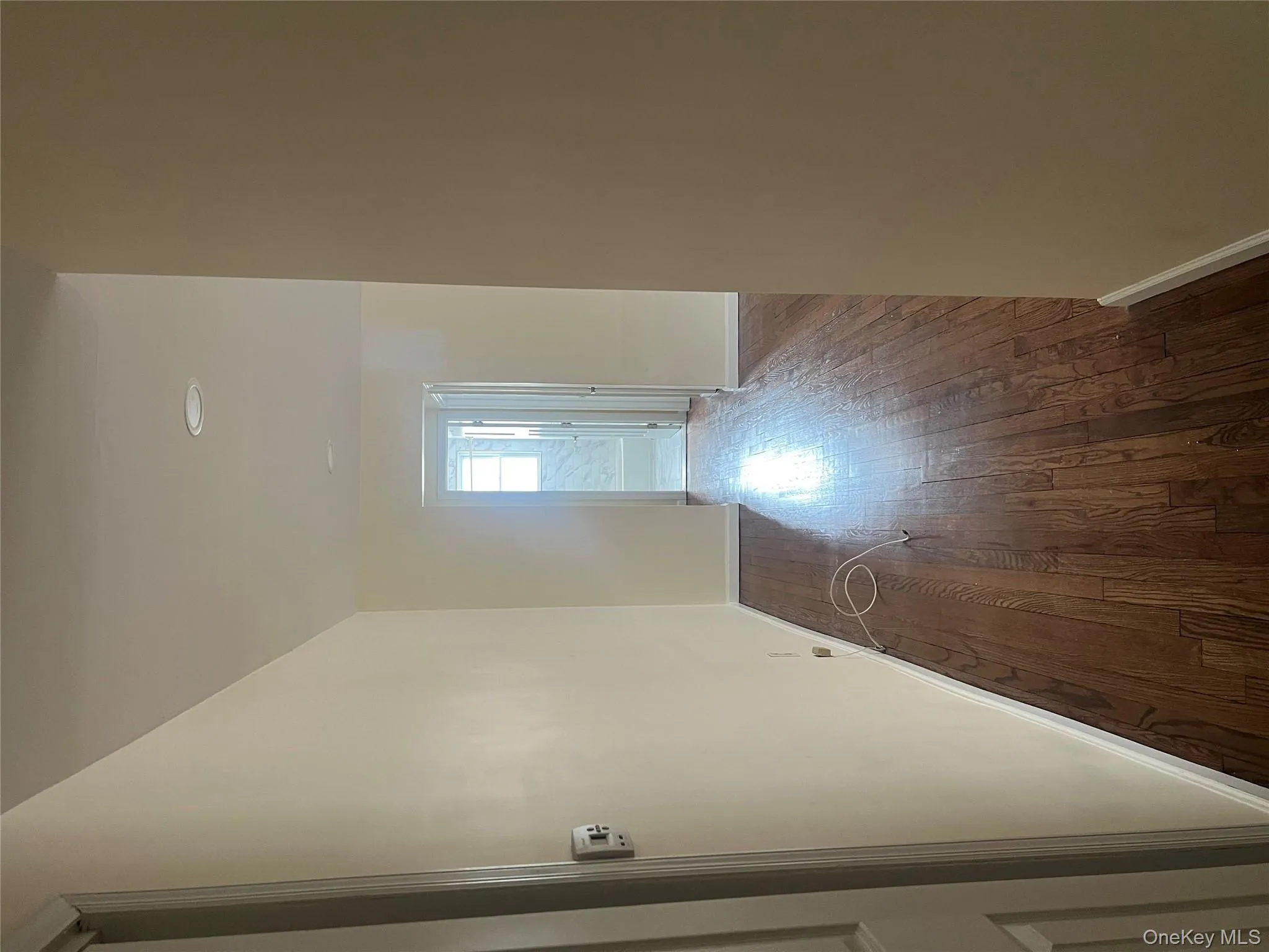 Corridor featuring dark wood-style flooring and recessed lighting Corridor featuring dark wood-style flooring and recessed lighting