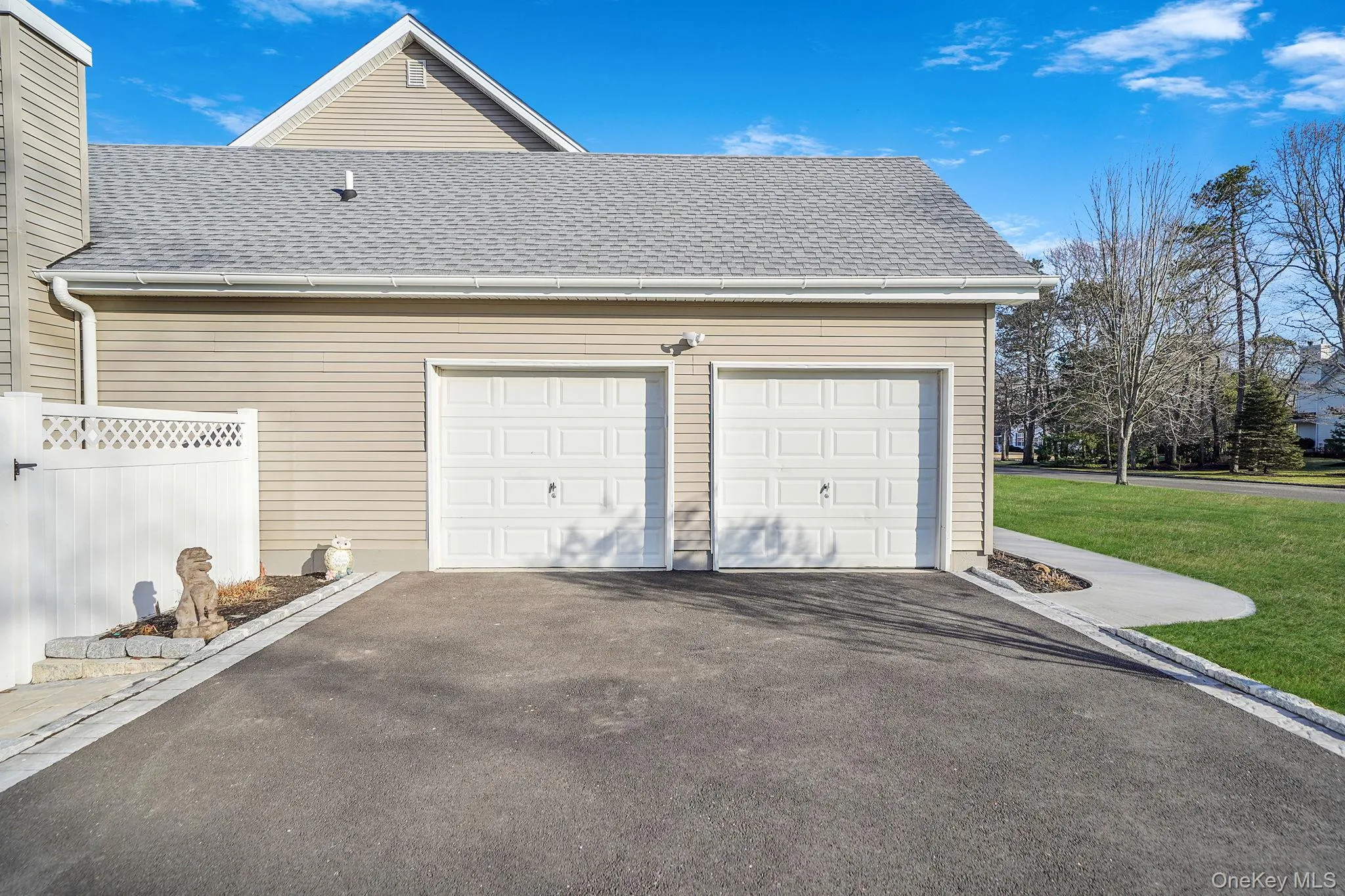 Garage featuring driveway Garage featuring driveway