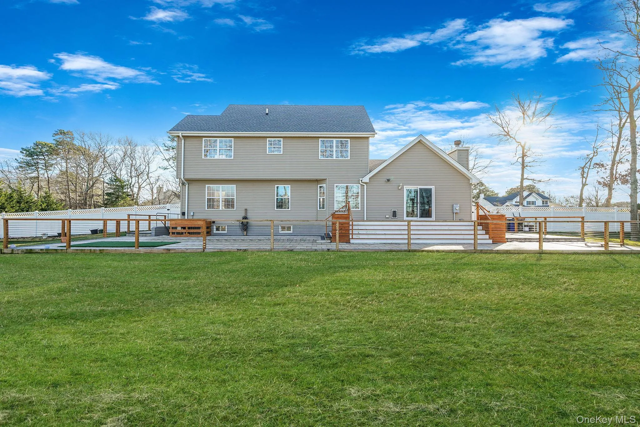 Rear view of property featuring a fenced backyard and a chimney Rear view of property featuring a fenced backyard and a chimney
