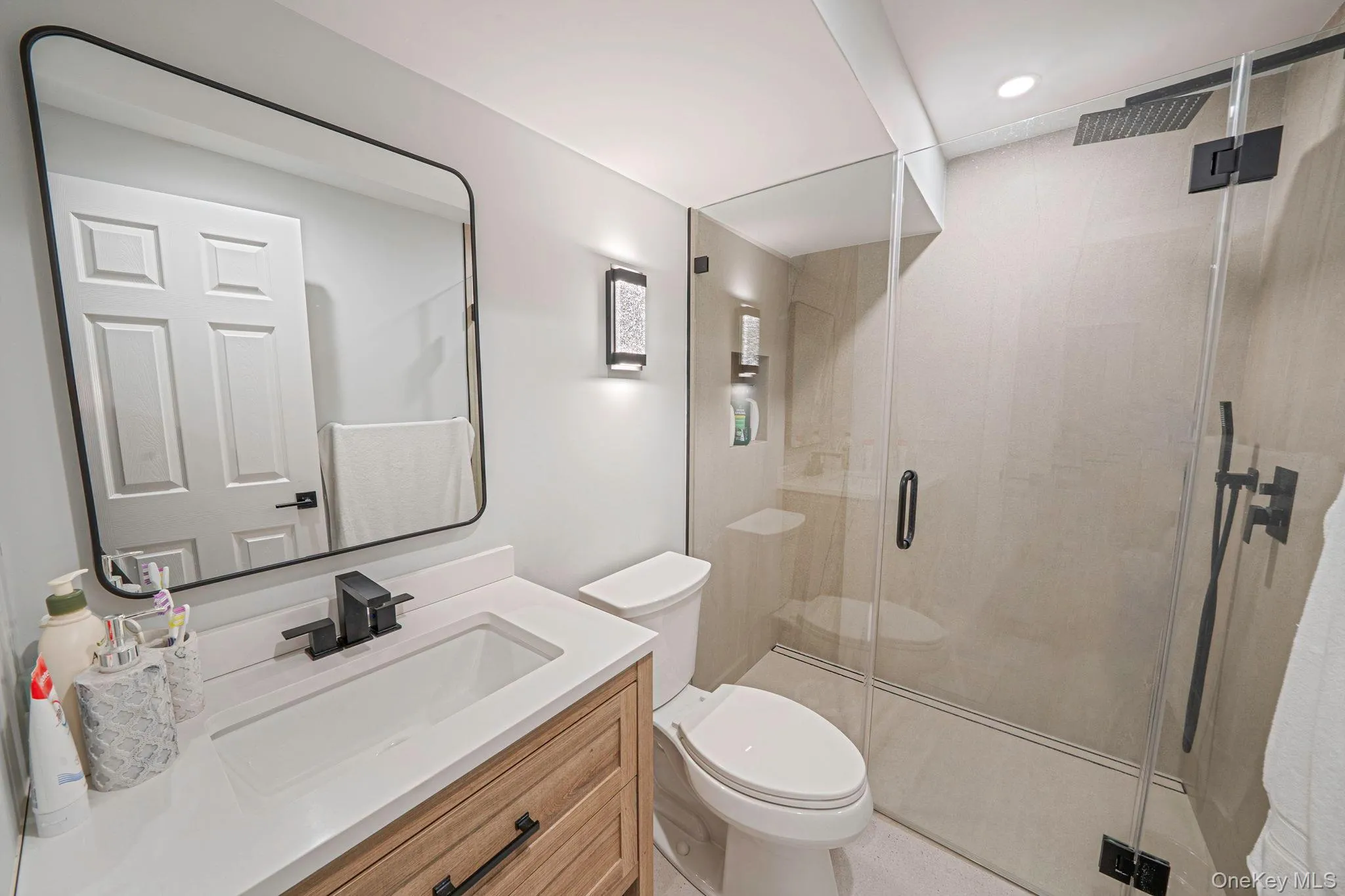 Basement Full bathroom with vanity and a shower stall Basement Full bathroom with vanity and a shower stall