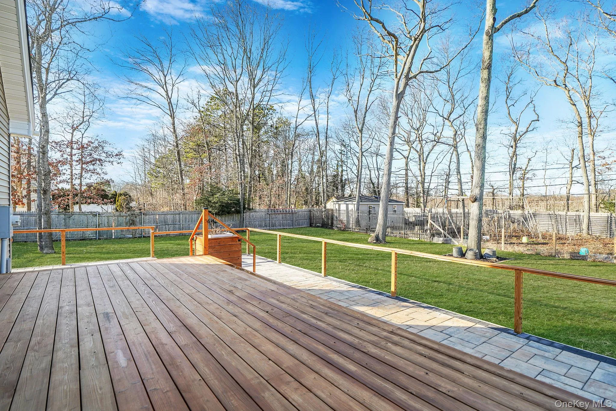 Deck featuring a fenced backyard and a trampoline Deck featuring a fenced backyard and a trampoline