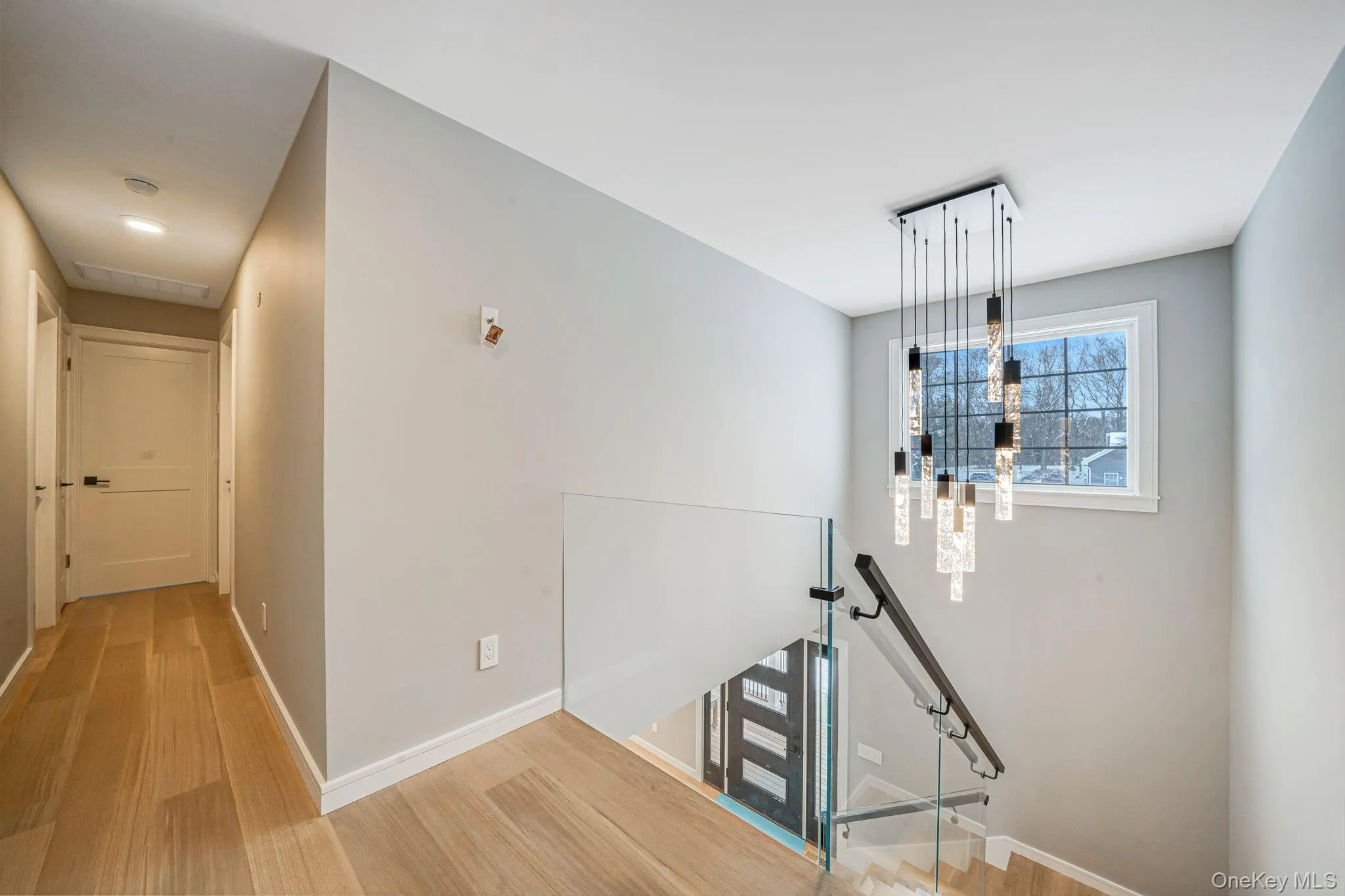 Stairs featuring wood finished floors Stairs featuring wood finished floors