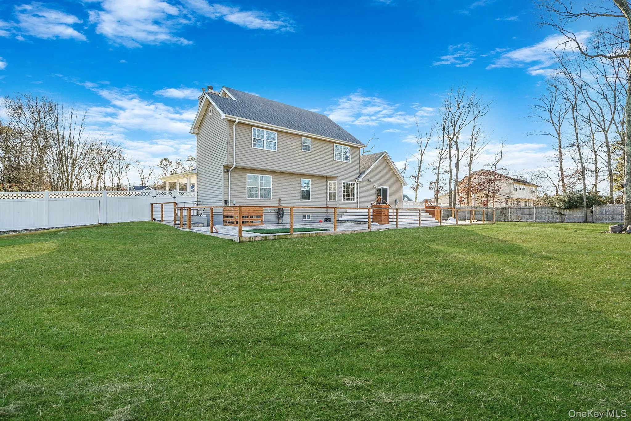 Rear view of house with a fenced backyard Rear view of house with a fenced backyard