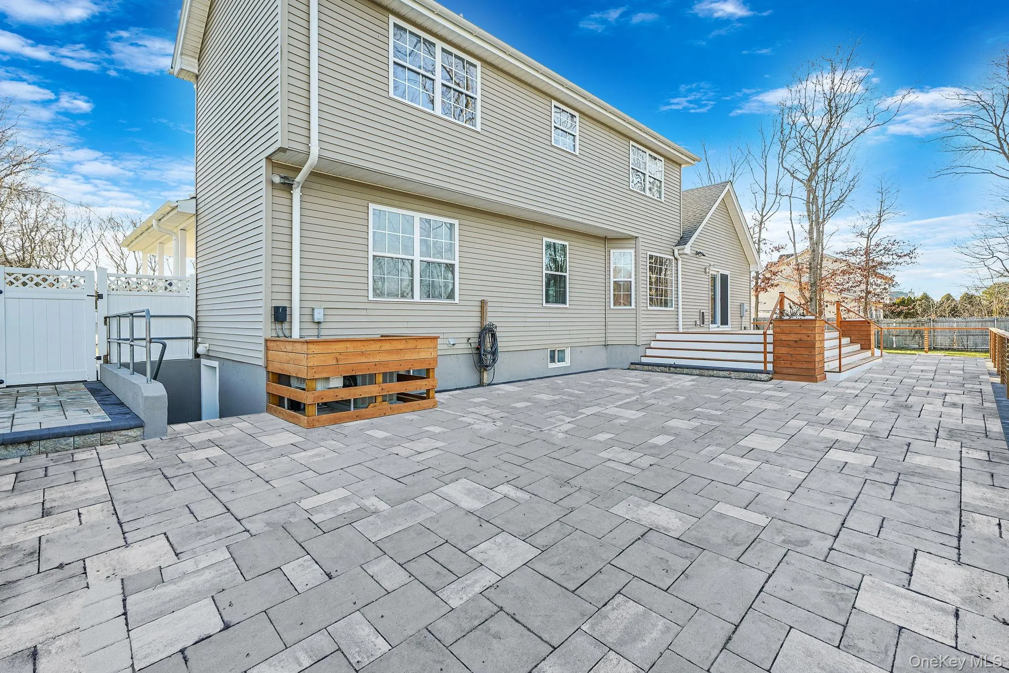 Back of house with a patio and a gate Back of house with a patio and a gate