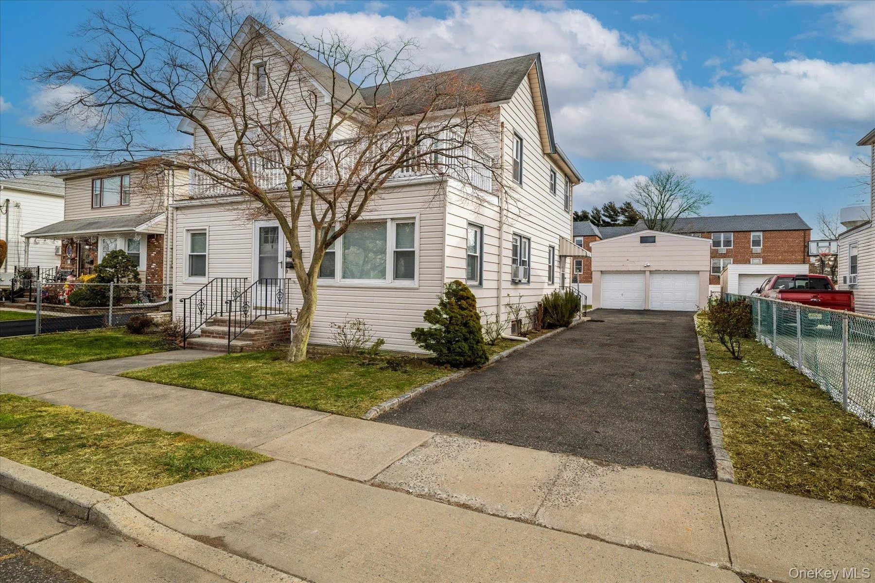 Traditional home featuring a detached garage Traditional home featuring a detached garage