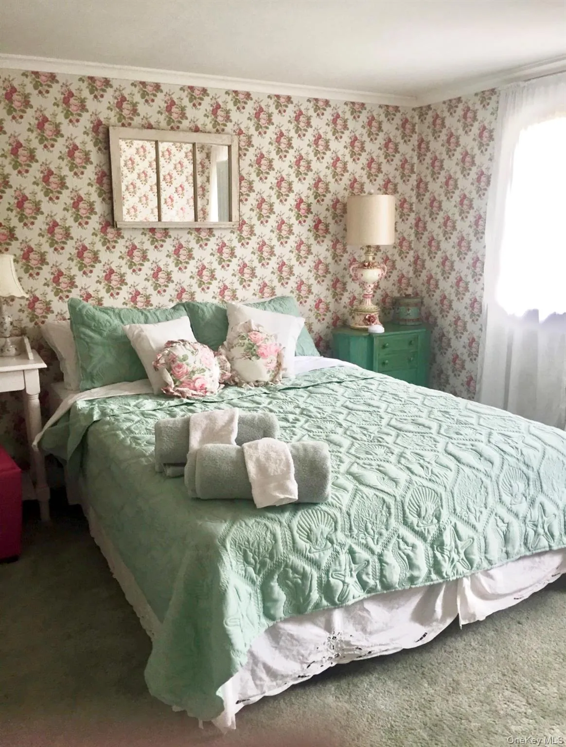 Bedroom featuring wallpapered walls, carpet flooring, and crown molding Bedroom featuring wallpapered walls, carpet flooring, and crown molding