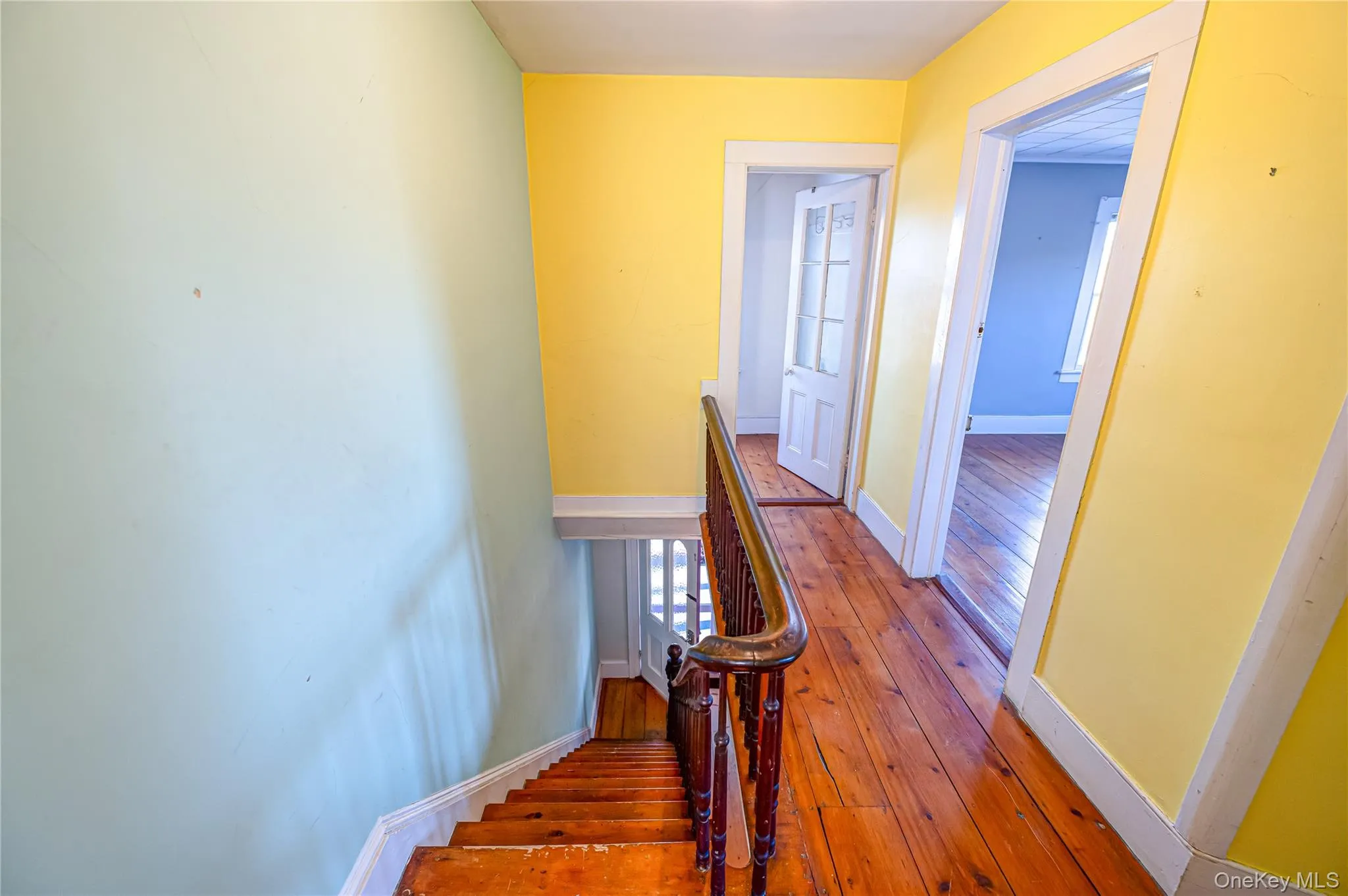 Staircase with wood-type flooring and baseboards Staircase with wood-type flooring and baseboards