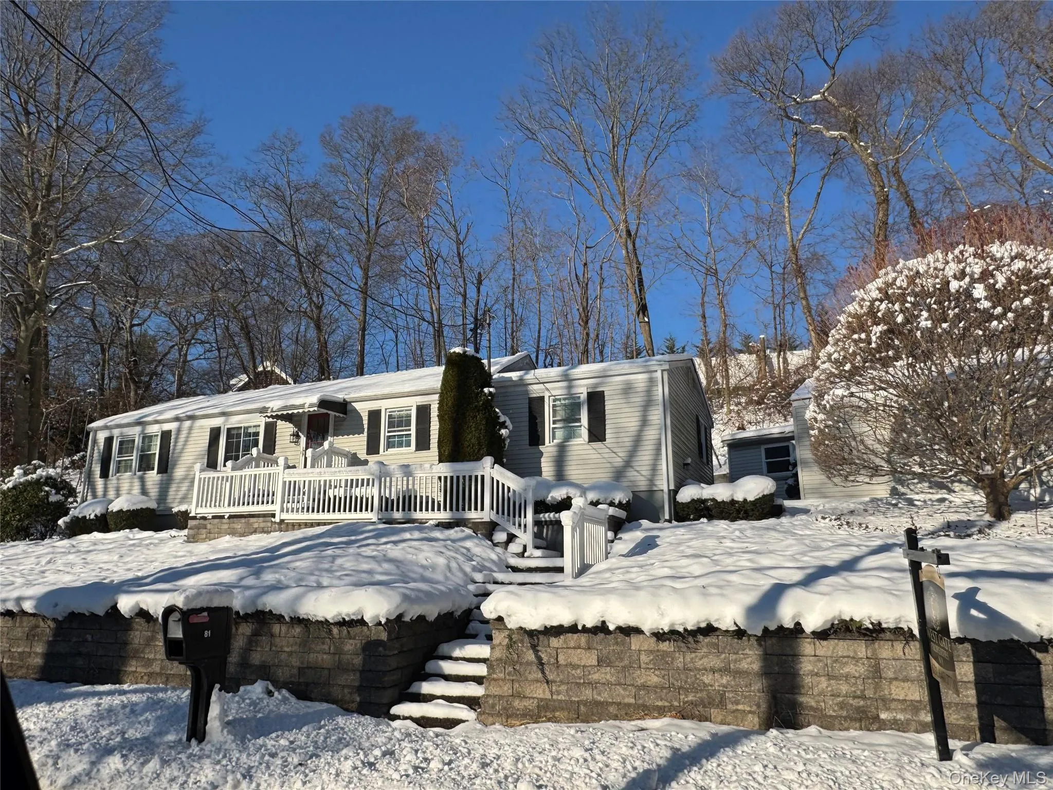 View of snow covered back of property View of snow covered back of property
