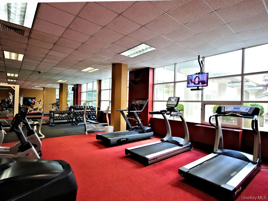 Exercise room featuring a drop ceiling Exercise room featuring a drop ceiling