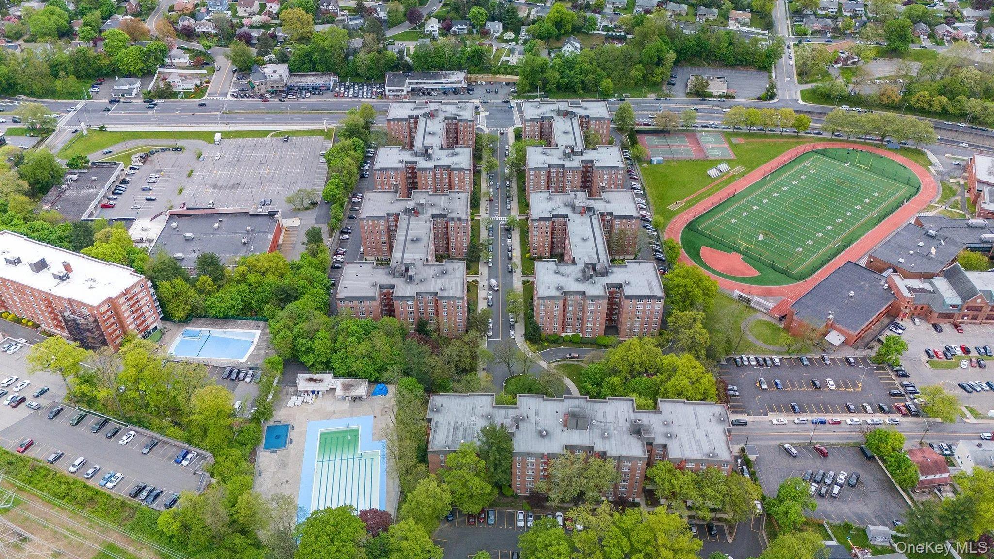 Aerial view of property's location with nearby urban area Aerial view of property's location with nearby urban area