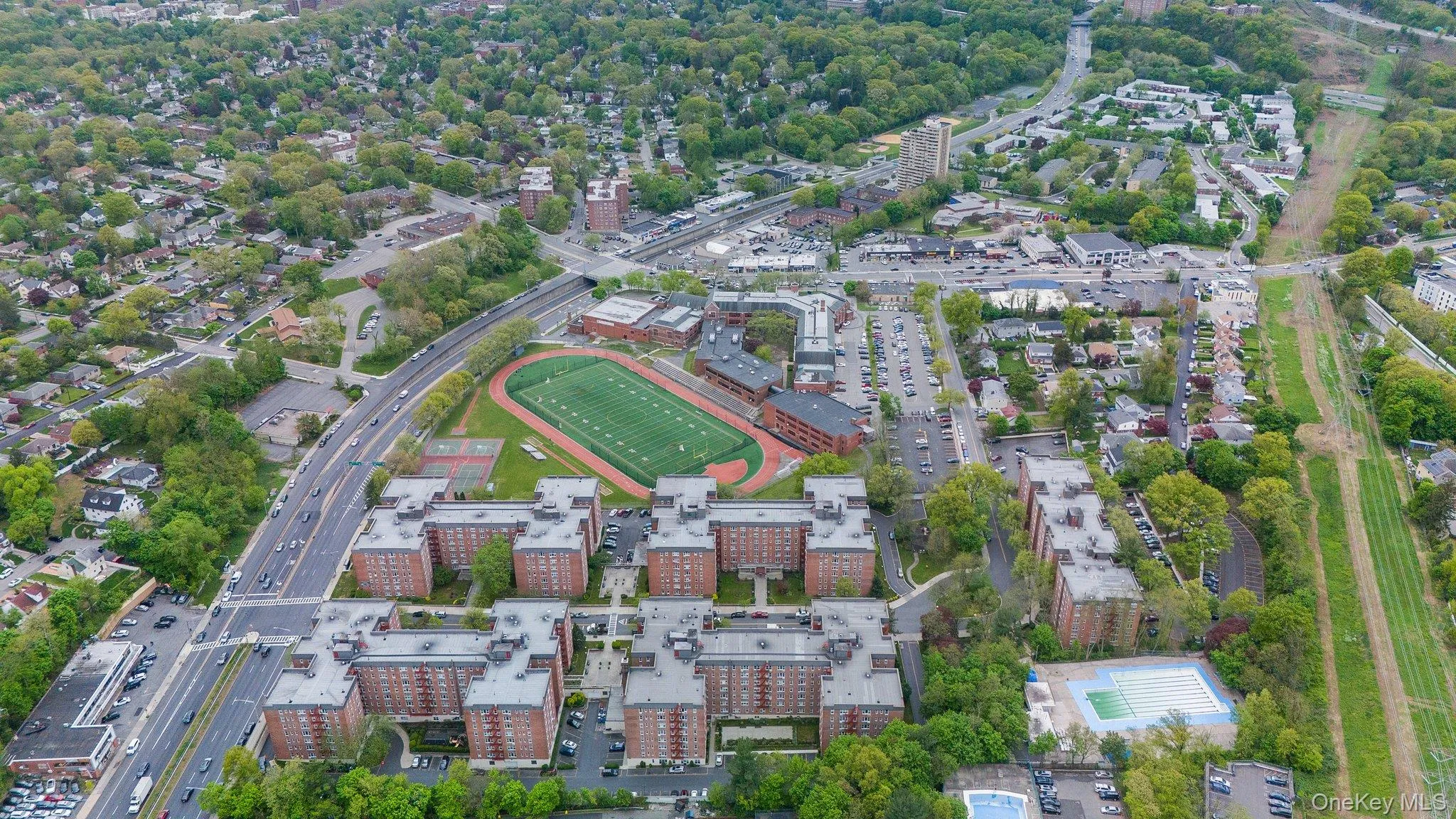 Aerial overview of property's location with nearby urban area Aerial overview of property's location with nearby urban area