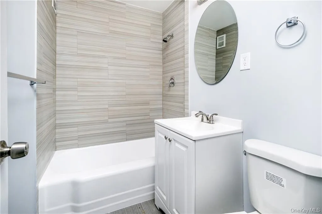 Full bathroom with tub / shower combination and vanity Full bathroom with tub / shower combination and vanity