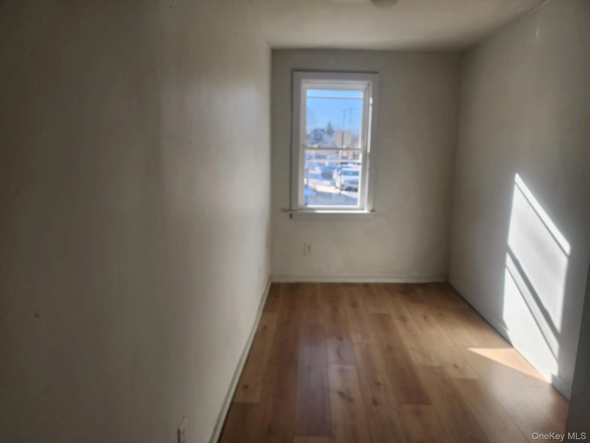Spare room featuring light wood-style flooring Spare room featuring light wood-style flooring