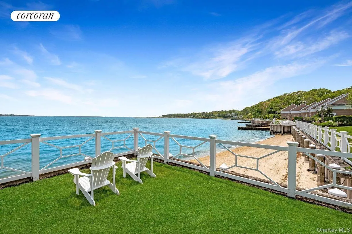 Dock with a water view and a lawn Dock with a water view and a lawn