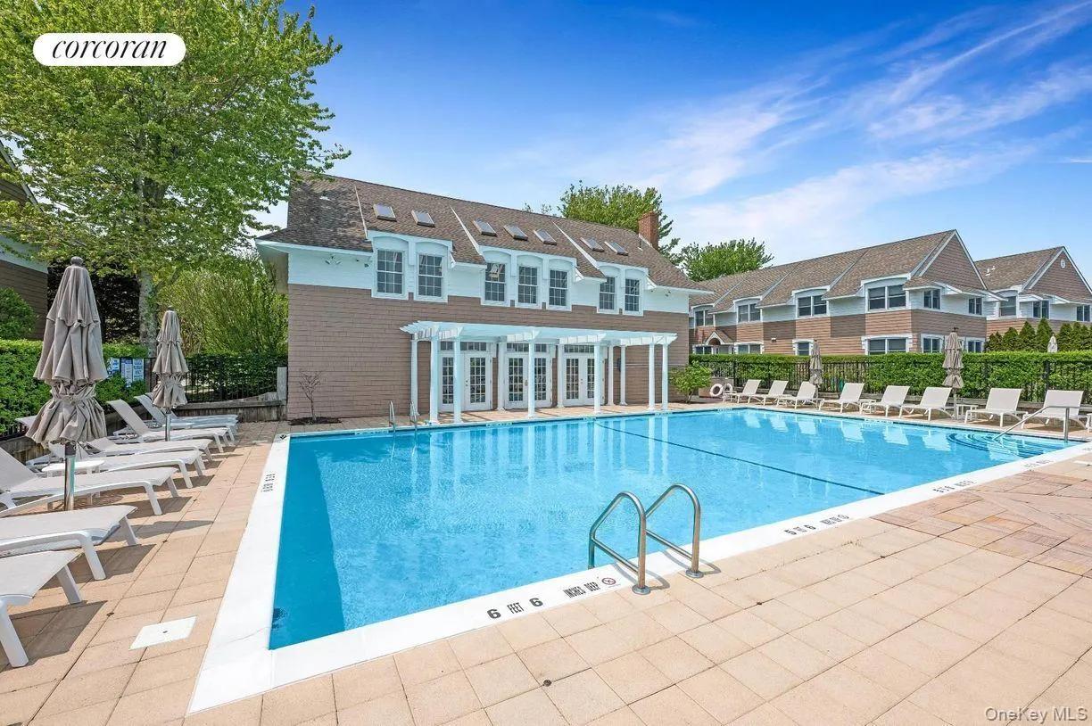 Community pool featuring a patio area Community pool featuring a patio area