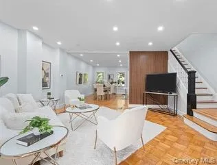 Living room featuring stairway and recessed lighting Living room featuring stairway and recessed lighting