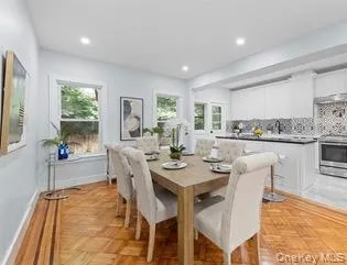 Dining room with healthy amount of natural light and recessed lighting Dining room with healthy amount of natural light and recessed lighting