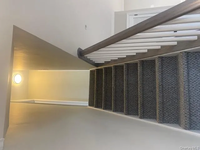 Stairs featuring ornamental molding and baseboards Stairs featuring ornamental molding and baseboards