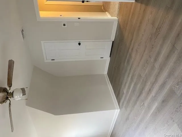 Additional living space featuring wood finished floors, a ceiling fan, and lofted ceiling Additional living space featuring wood finished floors, a ceiling fan, and lofted ceiling