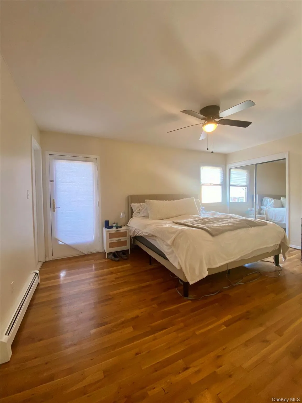 Primary king sized bedroom with three closets and a deck Primary king sized bedroom with three closets and a deck