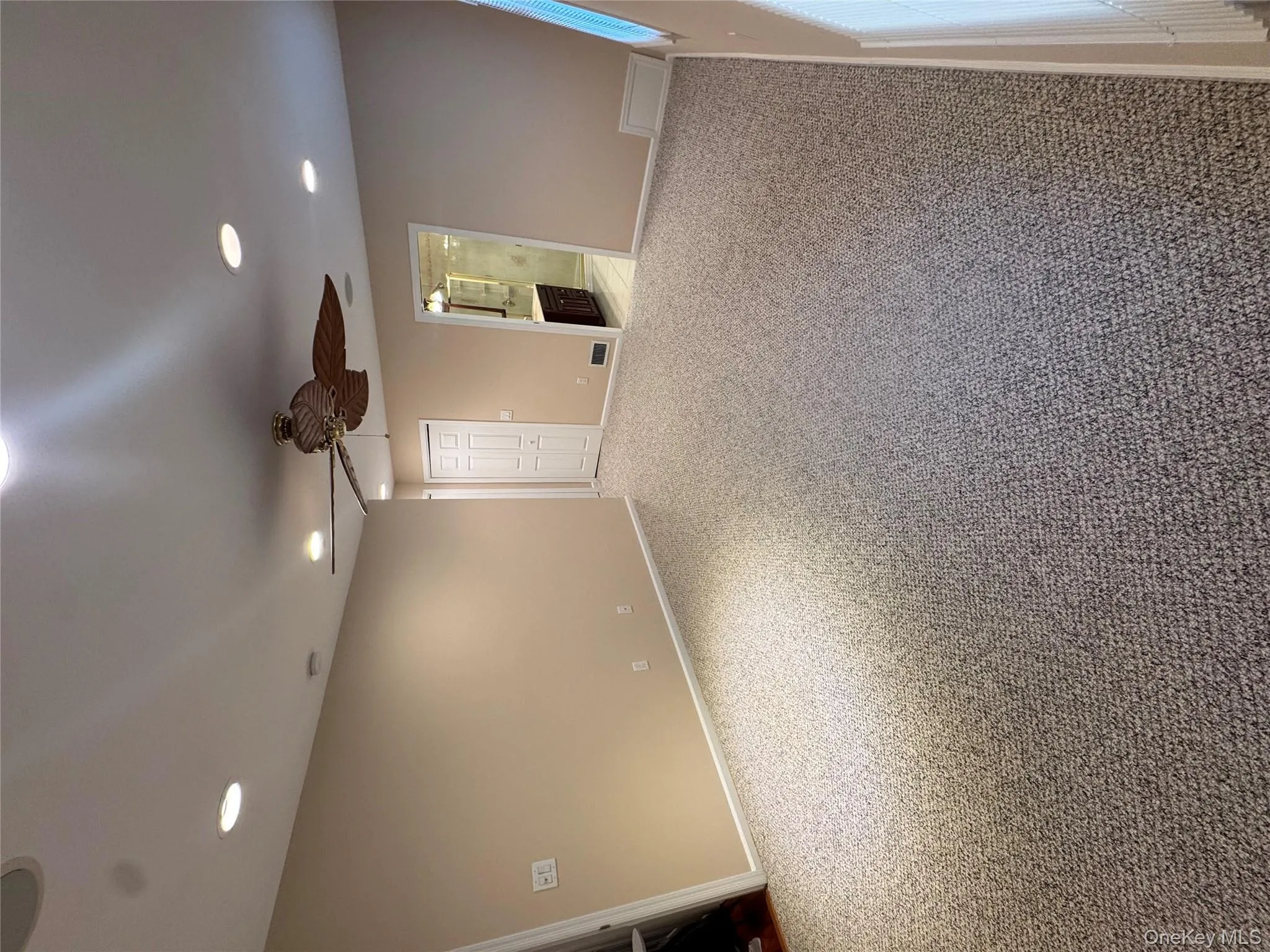 Empty room with carpet flooring, recessed lighting, and ceiling fan Empty room with carpet flooring, recessed lighting, and ceiling fan