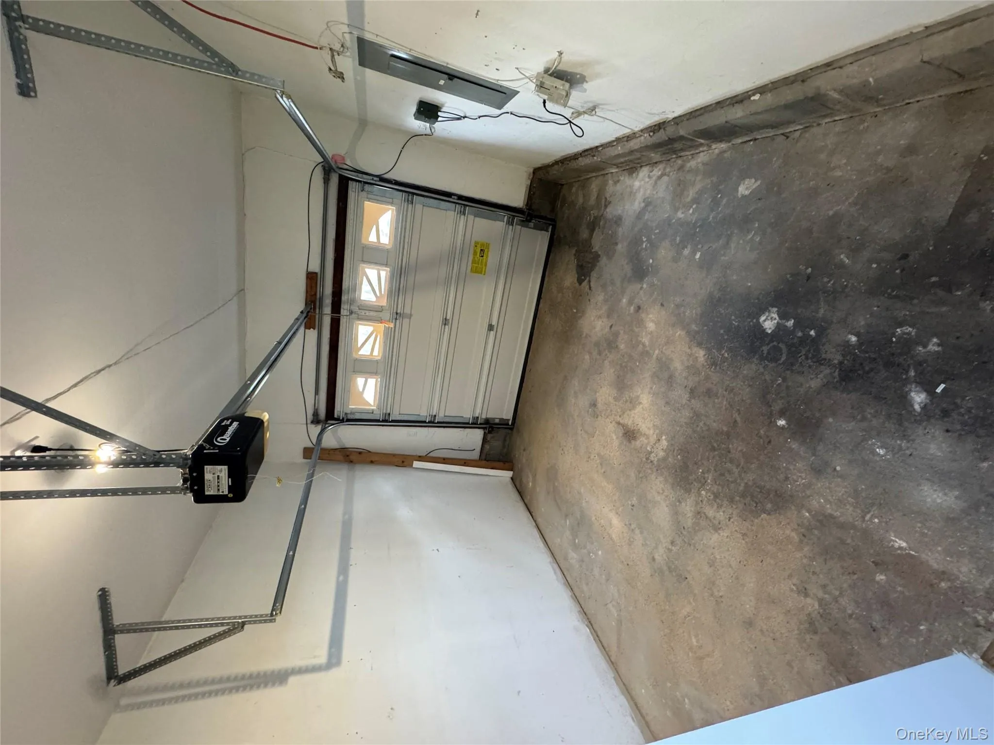 Garage with electric panel and a garage door opener Garage with electric panel and a garage door opener