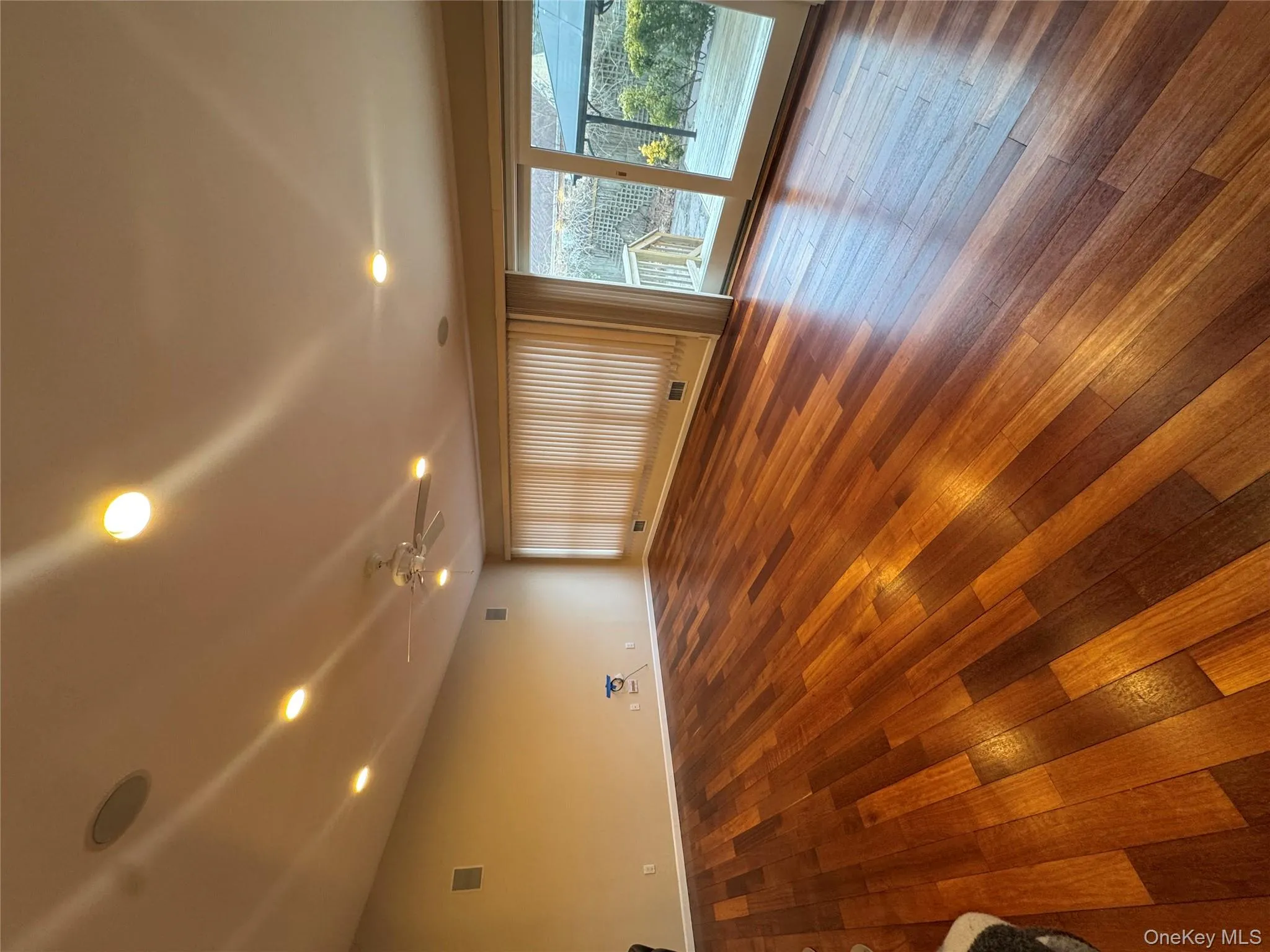 Empty room with hardwood / wood-style floors, recessed lighting, and ceiling fan Empty room with hardwood / wood-style floors, recessed lighting, and ceiling fan