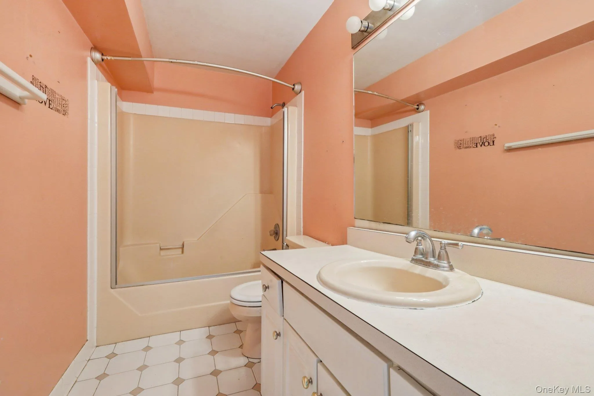 Full bath featuring vanity, tub / shower combination, and light flooring Full bath featuring vanity, tub / shower combination, and light flooring