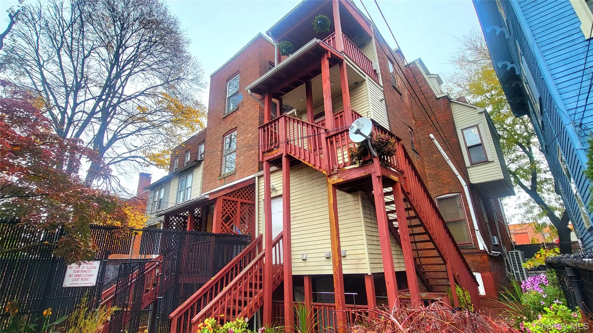 Entrance to the 3 bedroom apt up the stairs in rear of bldg Entrance to the 3 bedroom apt up the stairs in rear of bldg