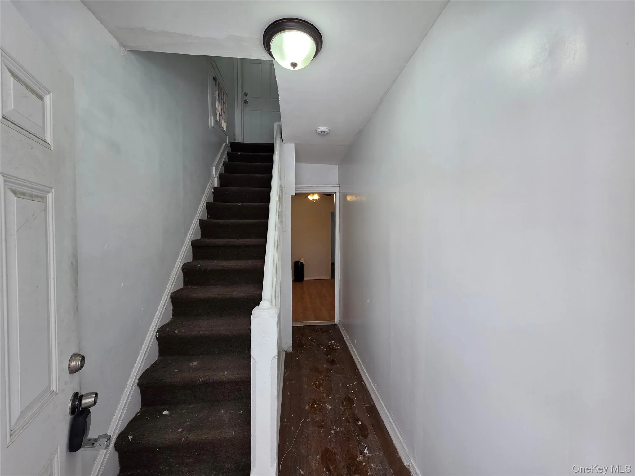 Stairway with wood finished floors and baseboards Stairway with wood finished floors and baseboards