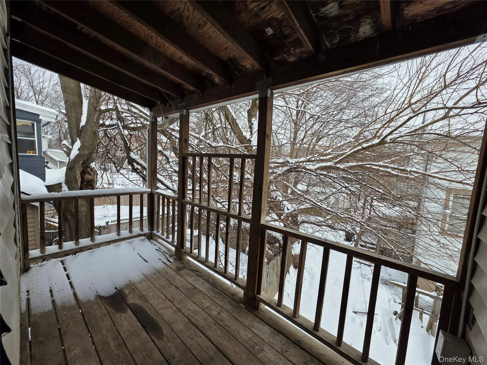 View of snow covered deck View of snow covered deck