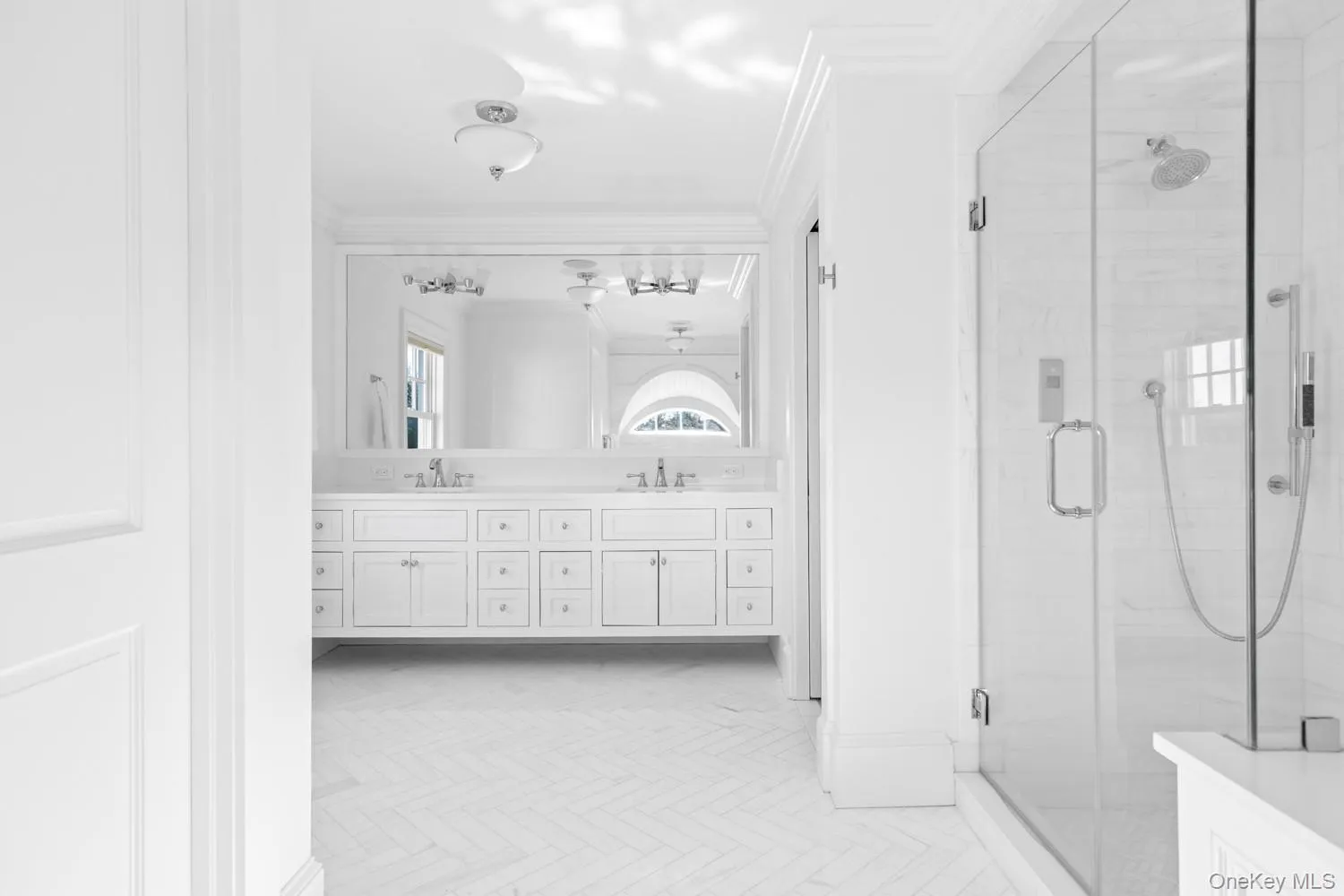 Full bath with double vanity, ornamental molding, and a shower stall Full bath with double vanity, ornamental molding, and a shower stall
