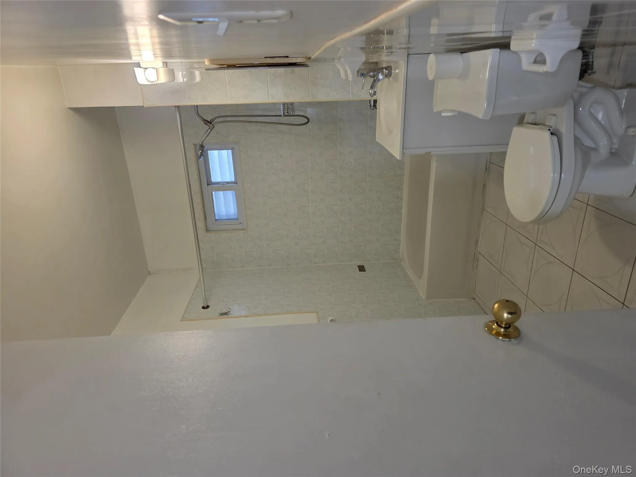 Full bathroom with light tile patterned floors, vanity, and shower / washtub combination Full bathroom with light tile patterned floors, vanity, and shower / washtub combination