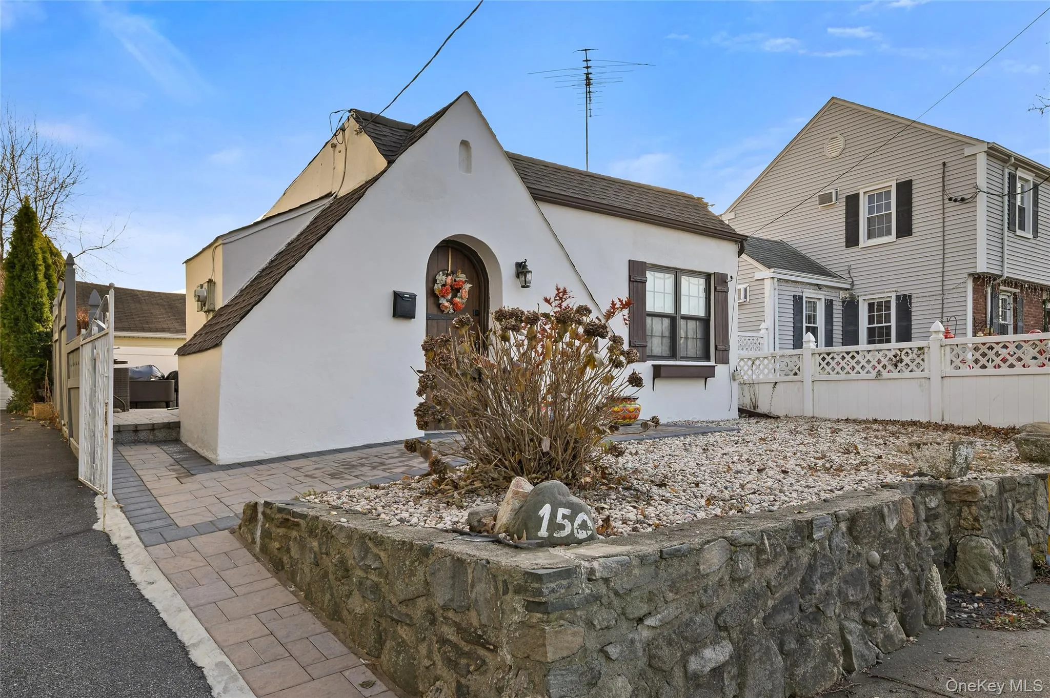 Tudor house featuring stucco siding Tudor house featuring stucco siding