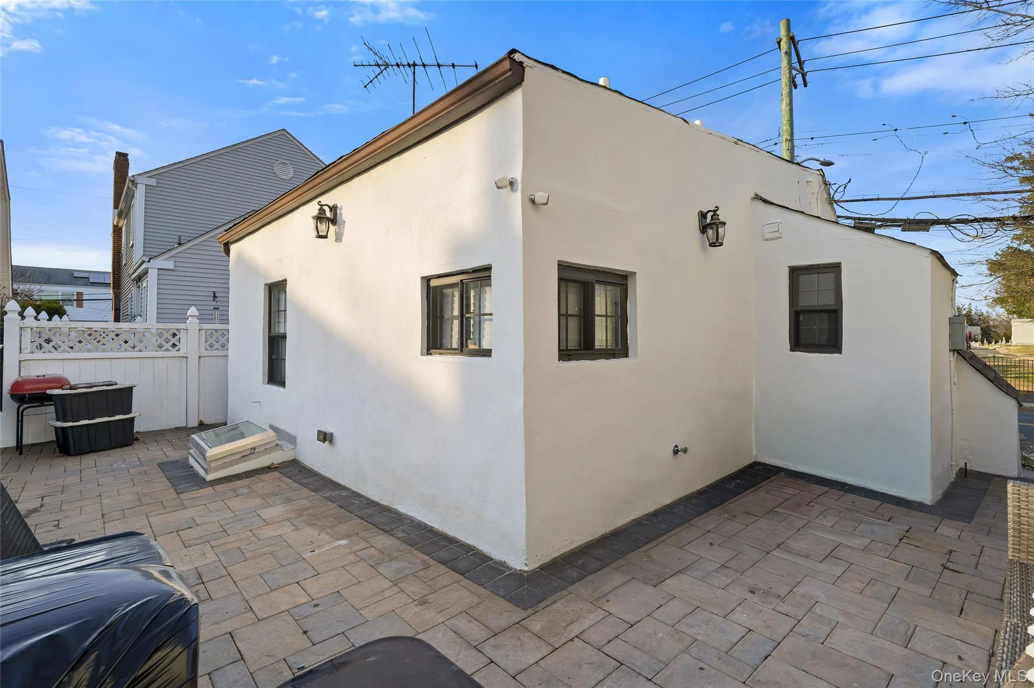 Back of property with stucco siding and a patio area Back of property with stucco siding and a patio area
