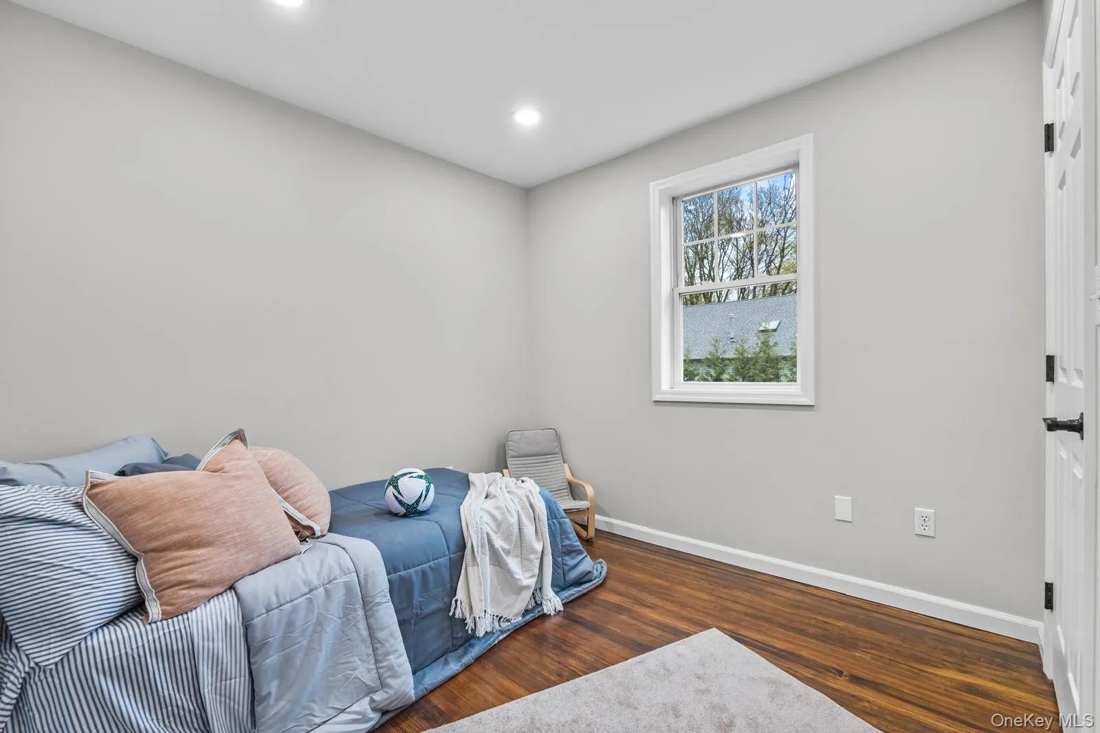 Bedroom featuring dark wood finished floors and recessed lighting Bedroom featuring dark wood finished floors and recessed lighting
